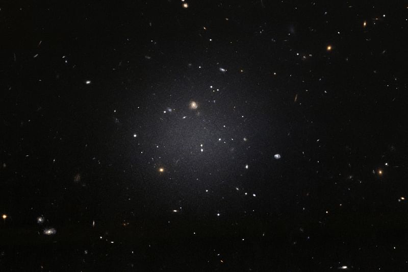 This handout image released by the European Space Agency (ESA) from the NASA/ESA Hubble Space telescope shows the NGC 1052-DF2 galaxy which is missing most, if not all, of its dark matter. Photo: AFP