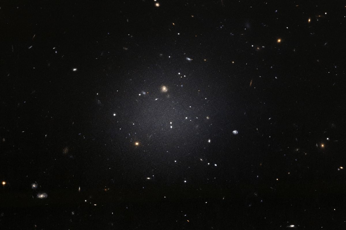 This handout image released by the European Space Agency (ESA) from the NASA/ESA Hubble Space telescope shows the NGC 1052-DF2 galaxy which is missing most, if not all, of its dark matter. Photo: AFP