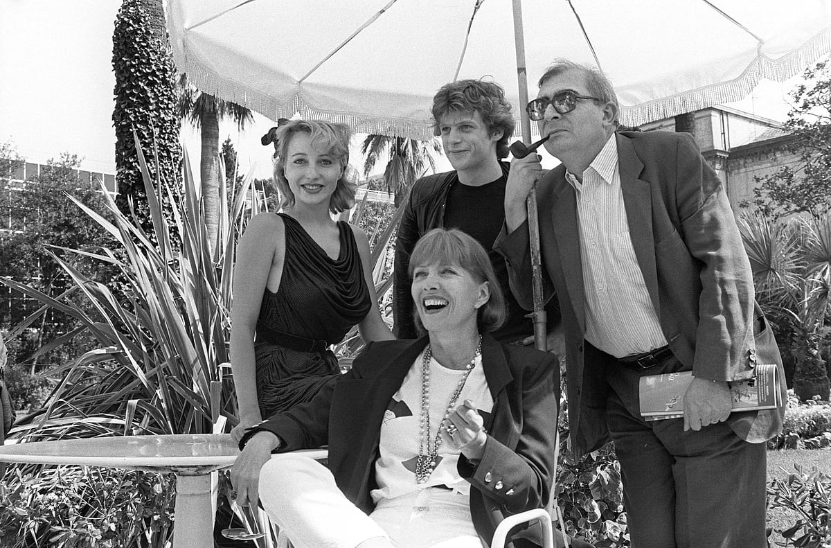 In this file photo taken on 16 May 1985 (from L), French actors Pauline Lafont, Lucas Belvaux, Stephane Audran (C), and film director Claude Chabrol pose for the presentation of the film `Poulet au Vinaigre` during the Cannes International Film Festival. Photo: AFP