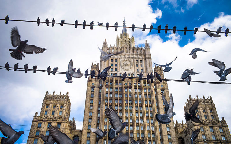 Pigeons take off from wires in front of the Russian Foreign Ministry building, in Moscow, Russia on 29 March. Photo: AP