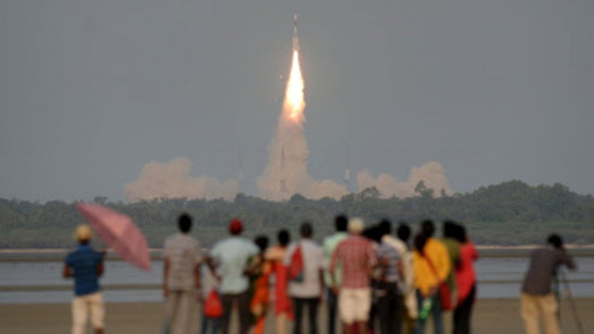 In this file photo taken on March 29, 2018, shows Indian onlookers watching as the Indian Space Research Organisation`s (ISRO) GSAT-6A communications satellite launches on the Geosynchronous Satellite Launch Vehicle (GSLV-F08) from Sriharikota in the southern state of Andhra Pradesh. Photo : AFP