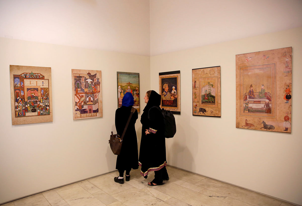 Women look at art exhibition at Babur Garden in Kabul, Afghanistan on 31 March 2018. Reuters