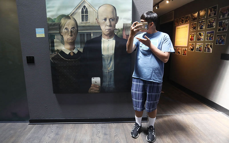 A man takes a selfie on opening day at the Museum of Selfies on 1 April 2018 in Glendale, California. AFP