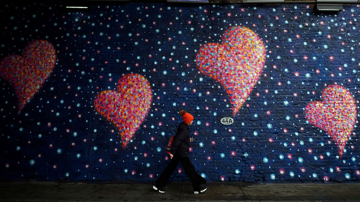 A woman walks past a mural, by British-born Australian artist James Cochran, painted to commemorate the victims of the London Bridge attack, in London, Britain on 2 April. Photo: Reuters