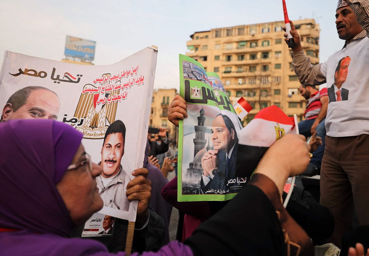 Supporters of Egyptian President Abdel Fattah al-Sisi celebrate in Cairo’s Tahrir square following his re-election for a second term on Monday. Photo: AFP
