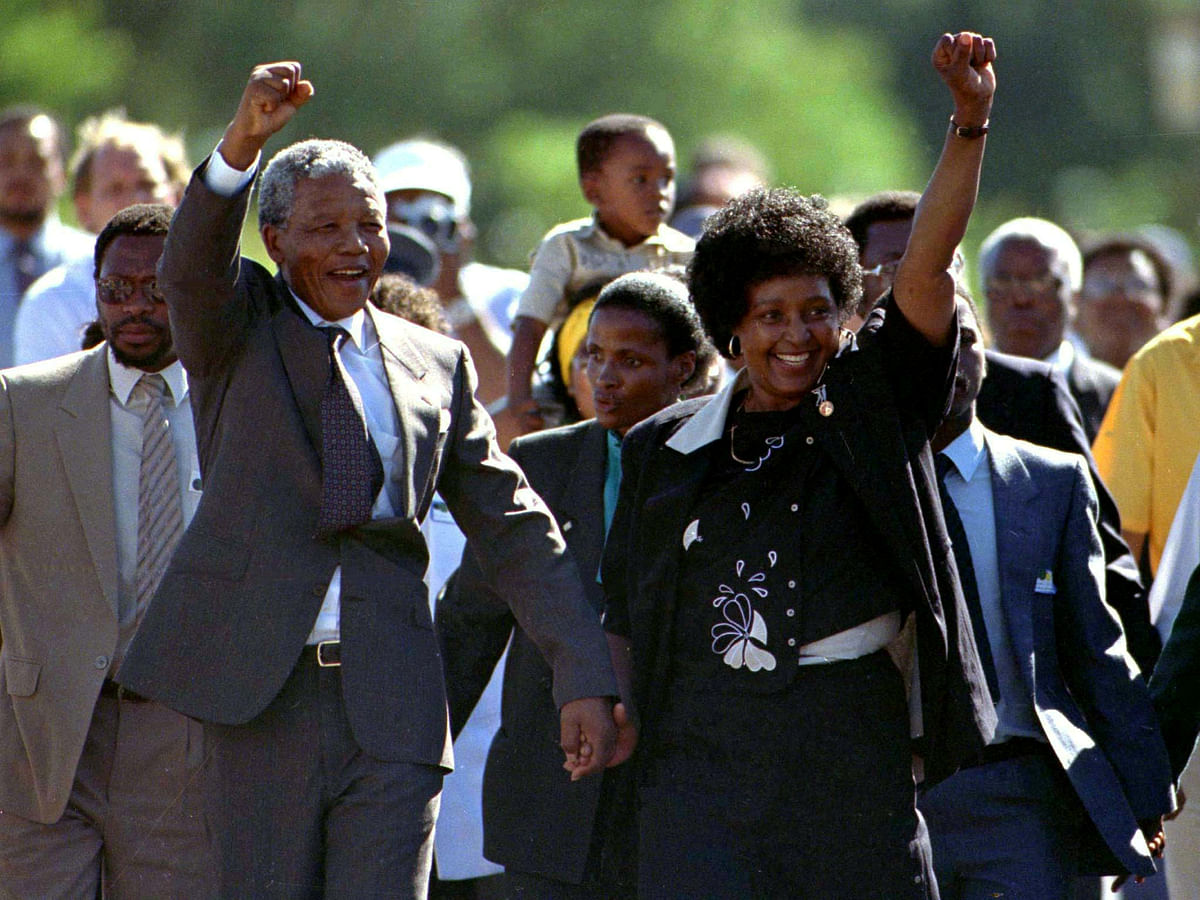 President Nelson Mandela is accompanied by his then wife Winnie, moments after his release from prison near Paarl, South Africa, 11 February 1990. Reuters