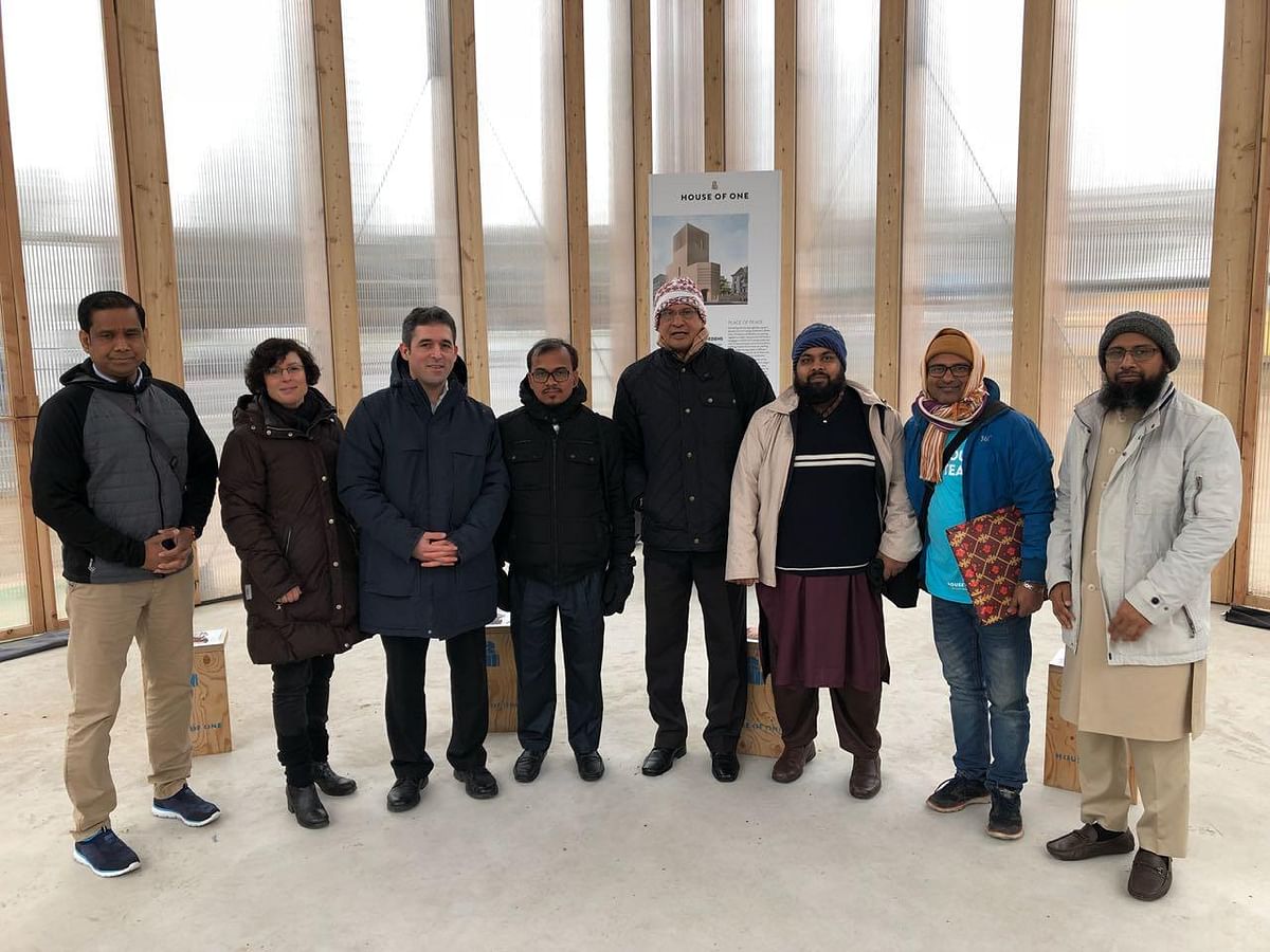 The writer (fourth from left) along with other members of Bangladesh delegation, which recently visited Berlin at the invitation of German federal government, is photographed with the officials of the House of One inside the wooden structure that stands on the proposed site of the House of One