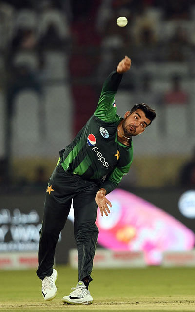 Pakistans` spinner Shadab Khan bowls during the second Twenty20 (T20) International cricket match between Pakistan and West Indies at the National Cricket Stadium in Karachi on 2 April, 2018. Photo: AFP