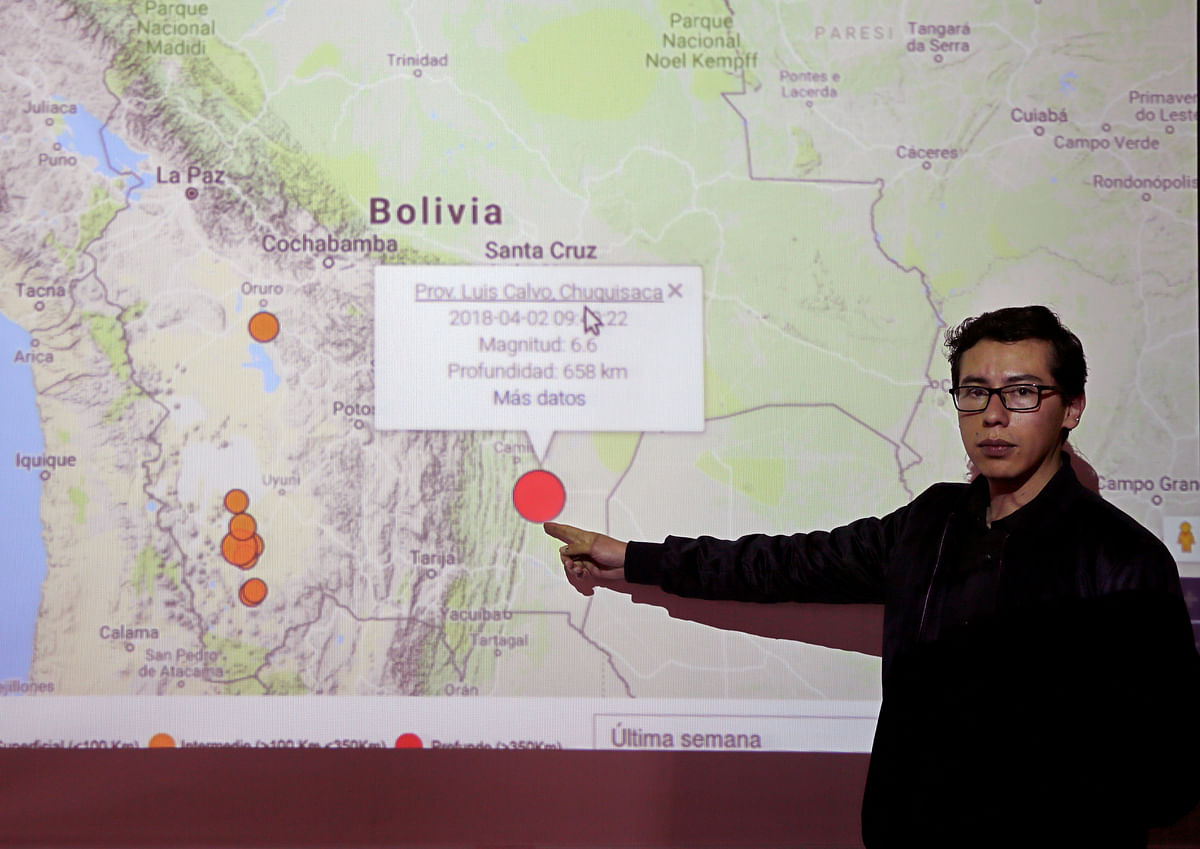 Seismologist Gonzalo Fernandez shows on a map the epicentre of an earthquake registered in the south of Bolivia, in La Paz, Bolivia on 2 April. Photo: Reuters