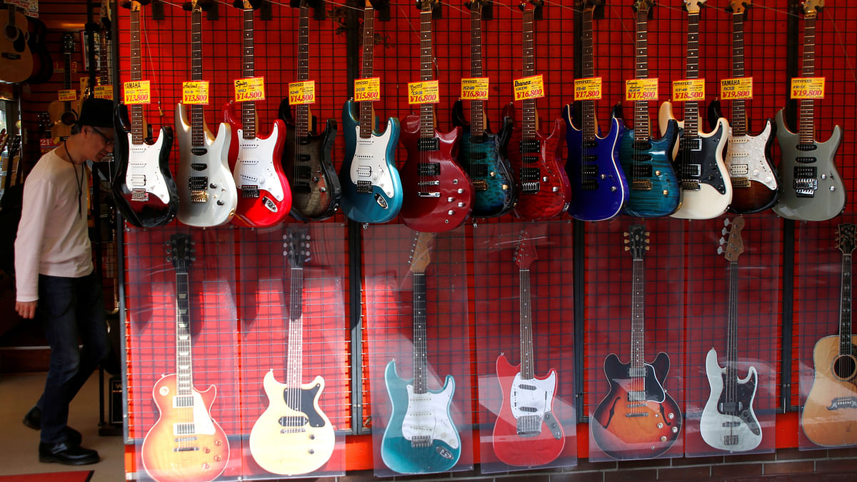 Guitars are displayed at a musical instruments shop in Tokyo, Japan on 3 April. Photo: Reuters