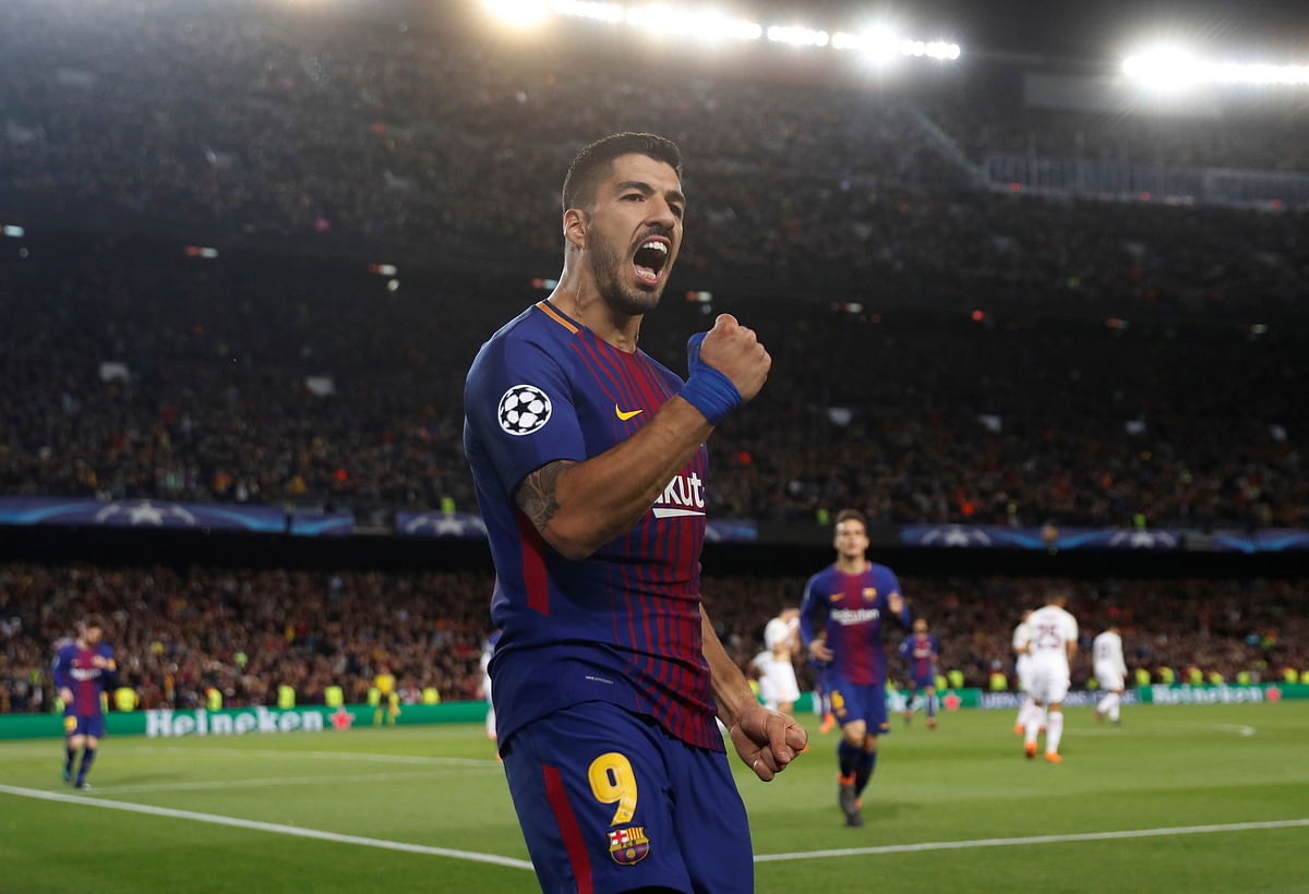 Barcelona’s Luis Suarez celebrates scoring their fourth goal against AS Roma in the Champions League quarter final first leg at Camp Nou, Barcelona, Spain on Wednesday. Photo: Reuters