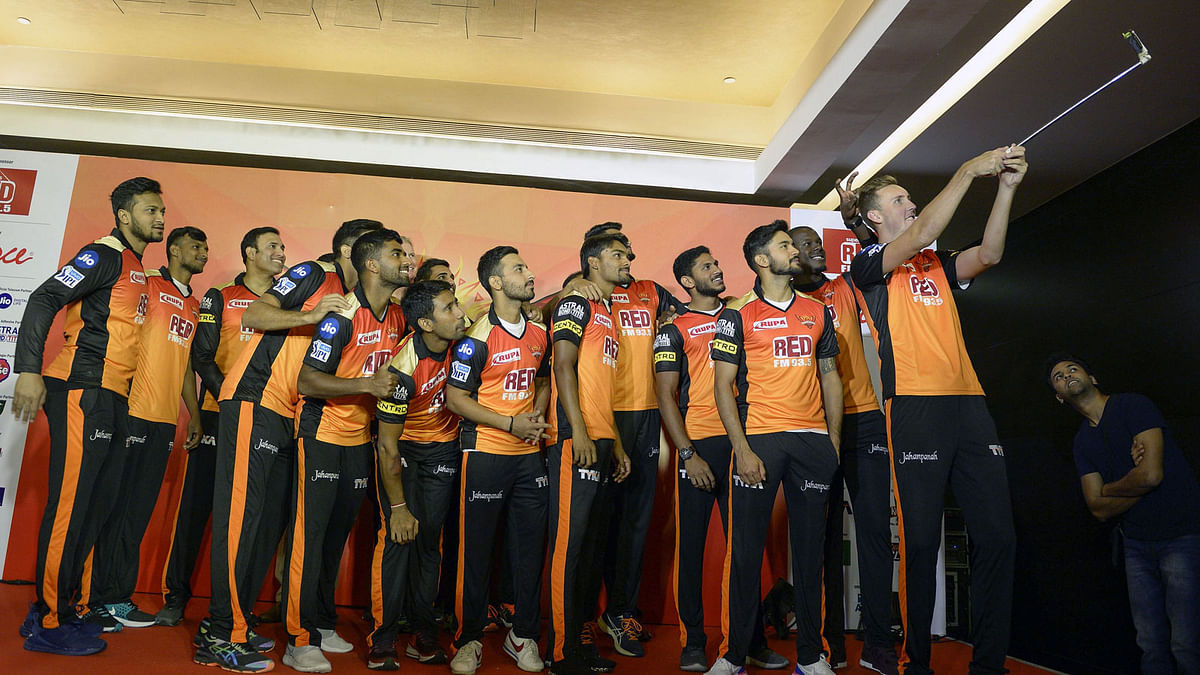 Sunrisers Hyderabad team member Alex Hales takes a selfie alongwith new team players during a promotional event in Hyderabad on 5 April, 2018, before the start of the 2018 Indian Premier League cricket tournament. Photo: AFP