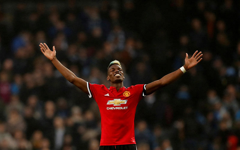 Manchester United’s Paul Pogba celebrates after the match between Manchester City and Manchester United at Etihad Stadium, Manchester, Britain on Saturday. Photo: Reuters