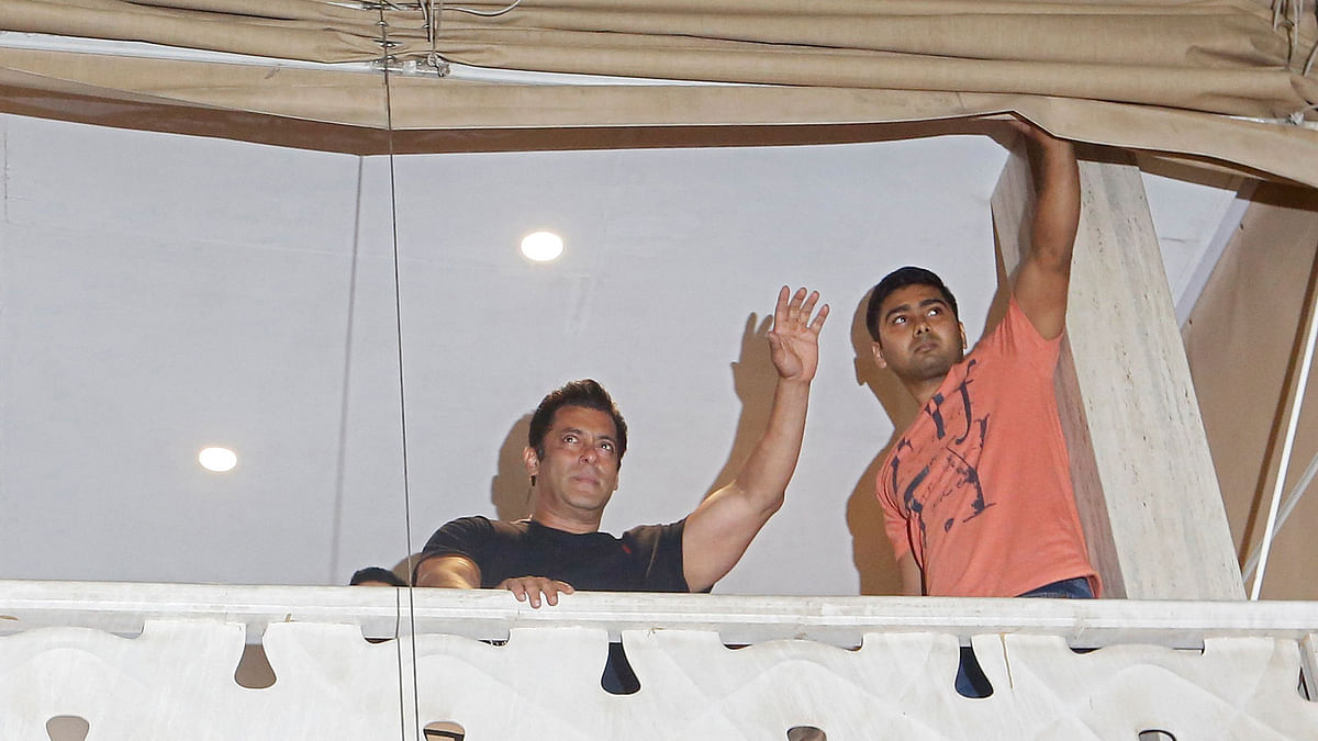 Bollywood actor Salman Khan waves towards his fans from a balcony upon his arrival at his home after a court in Jodhpur granted him bail, in Mumbai on 7 April. Photo: Reuters