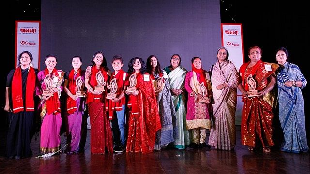 Recipients of ‘Ananya Shirsha Dosh’ award accompanied by others in the capital`s Bangla Academy on Saturday. Photo: Shubhra Kanti Das