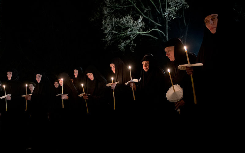 Kosovo Serb Orthodox nuns hold candles during an Easter vigil mass in the monastery of Gracanica during an Easter service, Kosovo on 8 April. Photo: AP