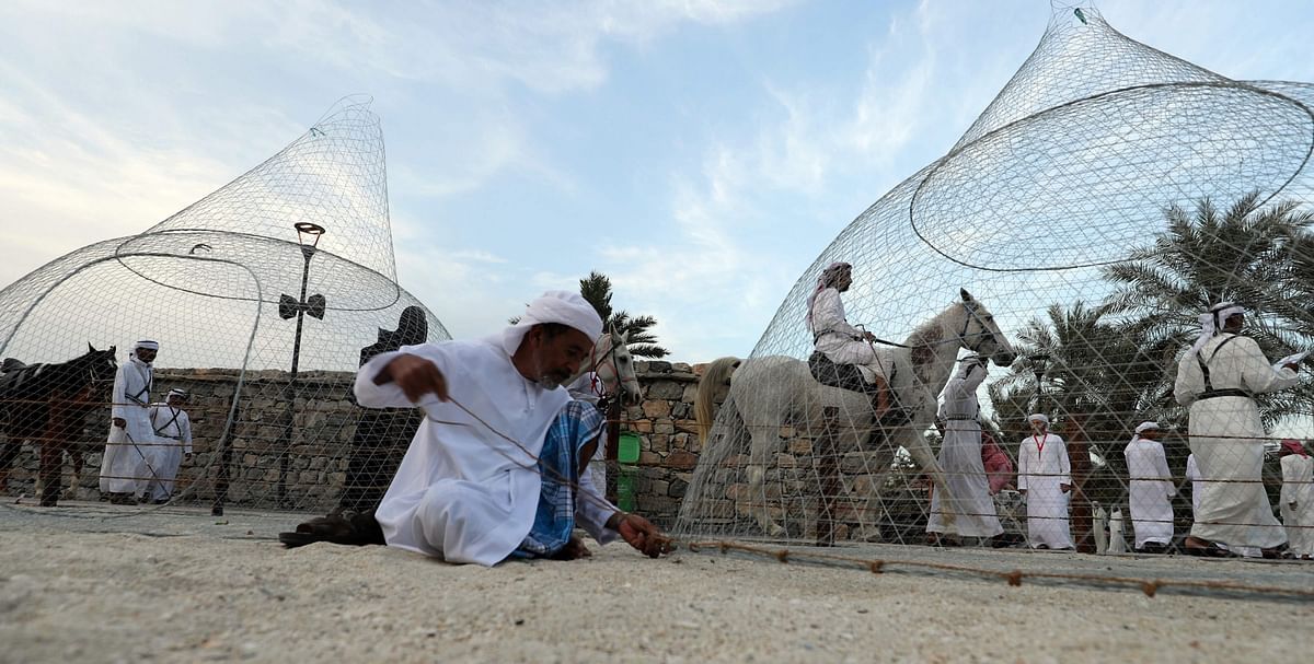 An Emirati fisherman prepares a cage during the Sharjah Heritage Days festival on 8 April 2018, at the Heritage Area in the United Arab Emirate. AFP