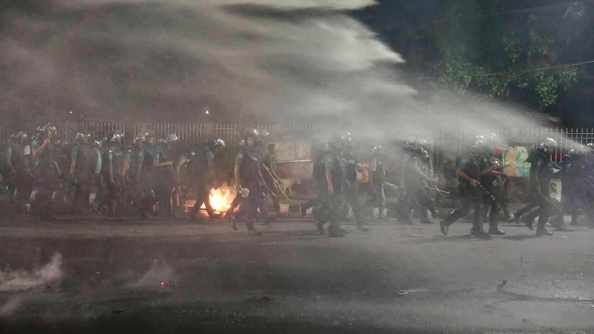 Police use water cannons on the protestors on 8 April. Photo: Suvra Kanti Das