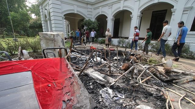 Furniture from Dhaka University vice chancellor (VC)’s residence was set on fire outside his house on Sunday night. Photo: Prothom Alo