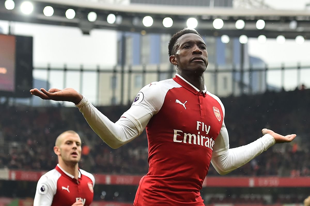 Arsenal's English striker Danny Welbeck (R) celebrates scoring the team's third goal with Arsenal's English midfielder Jack Wilshere during the English Premier League football match between Arsenal and Southampton at the Emirates Stadium in London on Sunday. Photo: AFP