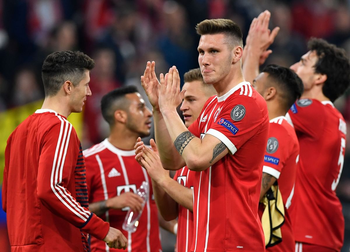 Bayern Munich’s players react after the UEFA Champions League quarter-final second leg football match between FC Bayern Munich and Sevilla FC on Wednesday. Photo: AFP