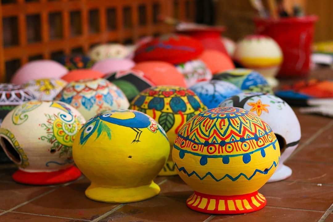 Colourful alpana (motifs) on clay pots, designed by students of East West University (EWU) ahead of the Pahela Baishakh celebrations. Photo: Collected
