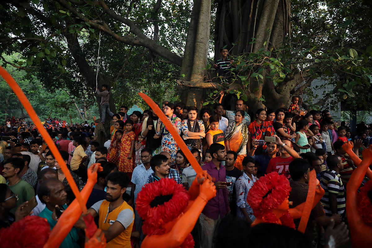 People gather in a Hindu temple to enjoy the Lal Kach festival in Narayanganj. Reuters