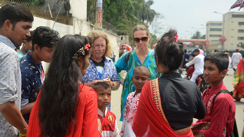 Foreigners too join the celebration of Pahela Baishakh on Dhaka University campus. Photo: Galib Ashraf.