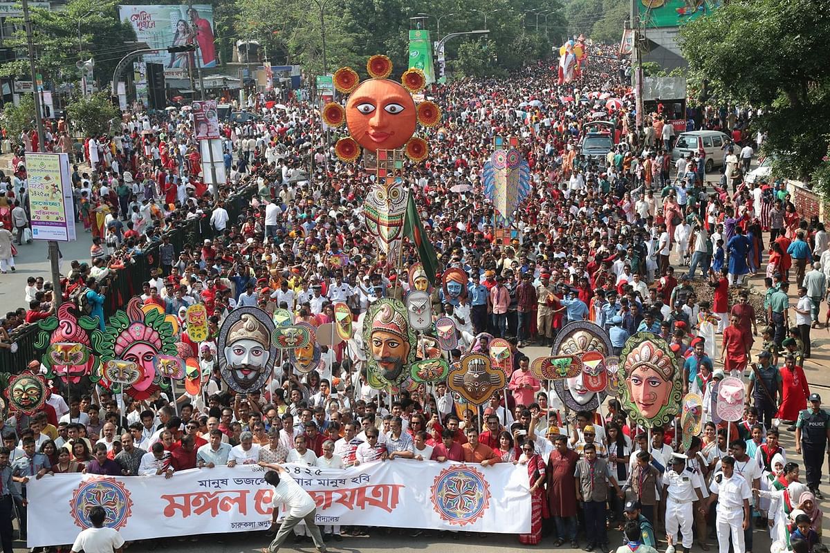 Thousands of people from all walks of life join the Mangal Shobhajatra (a traditional parade), brought out by the Dhaka University fine arts faculty, marking Pahela Baishakh, the first day of Bengali new year on 14 April. Photo: Sajid Hossain