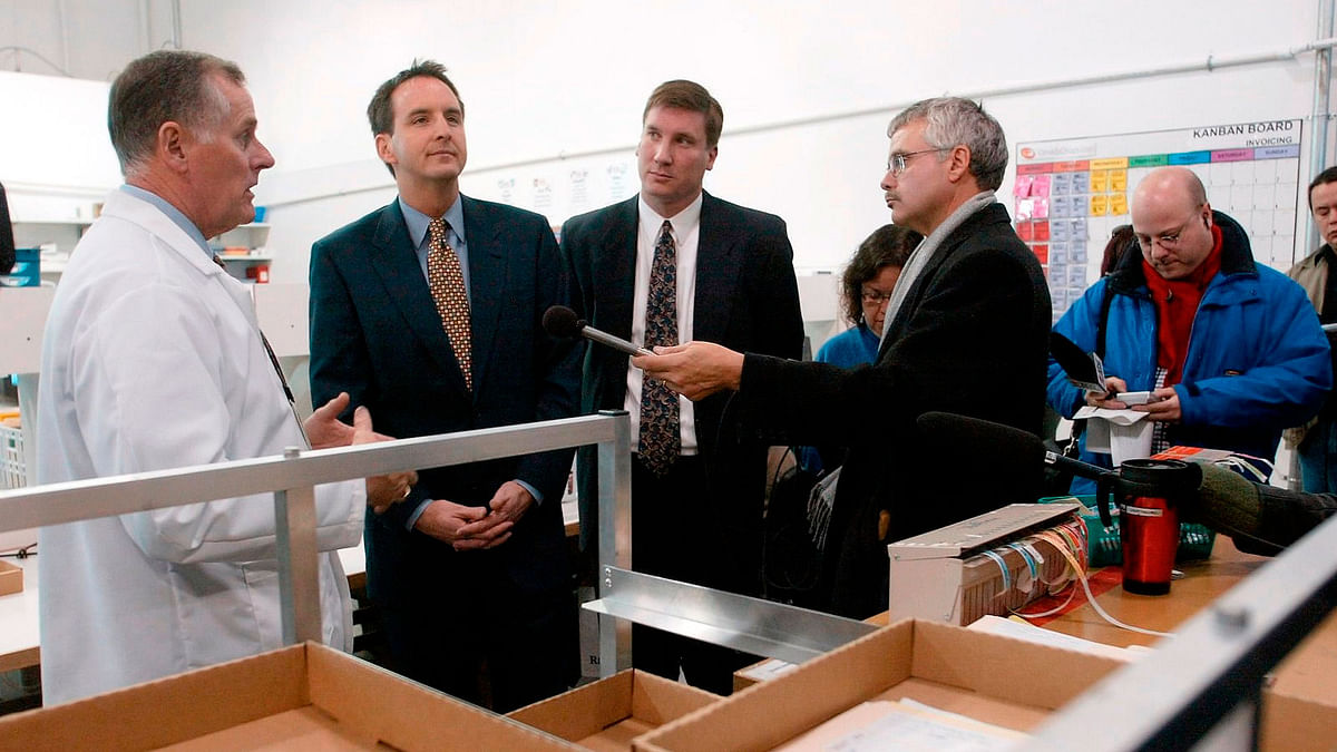 In this Nov. 12, 2003, file photo, CanadaDrugs.com Director of Pharmacy Robert Fraser, left, takes Minnesota Gov. Tim Pawlenty, second left, on a tour of the Internet pharmacy CanadaDrugs.com in Winnipeg, Manitoba in Canada. File Photo : AP