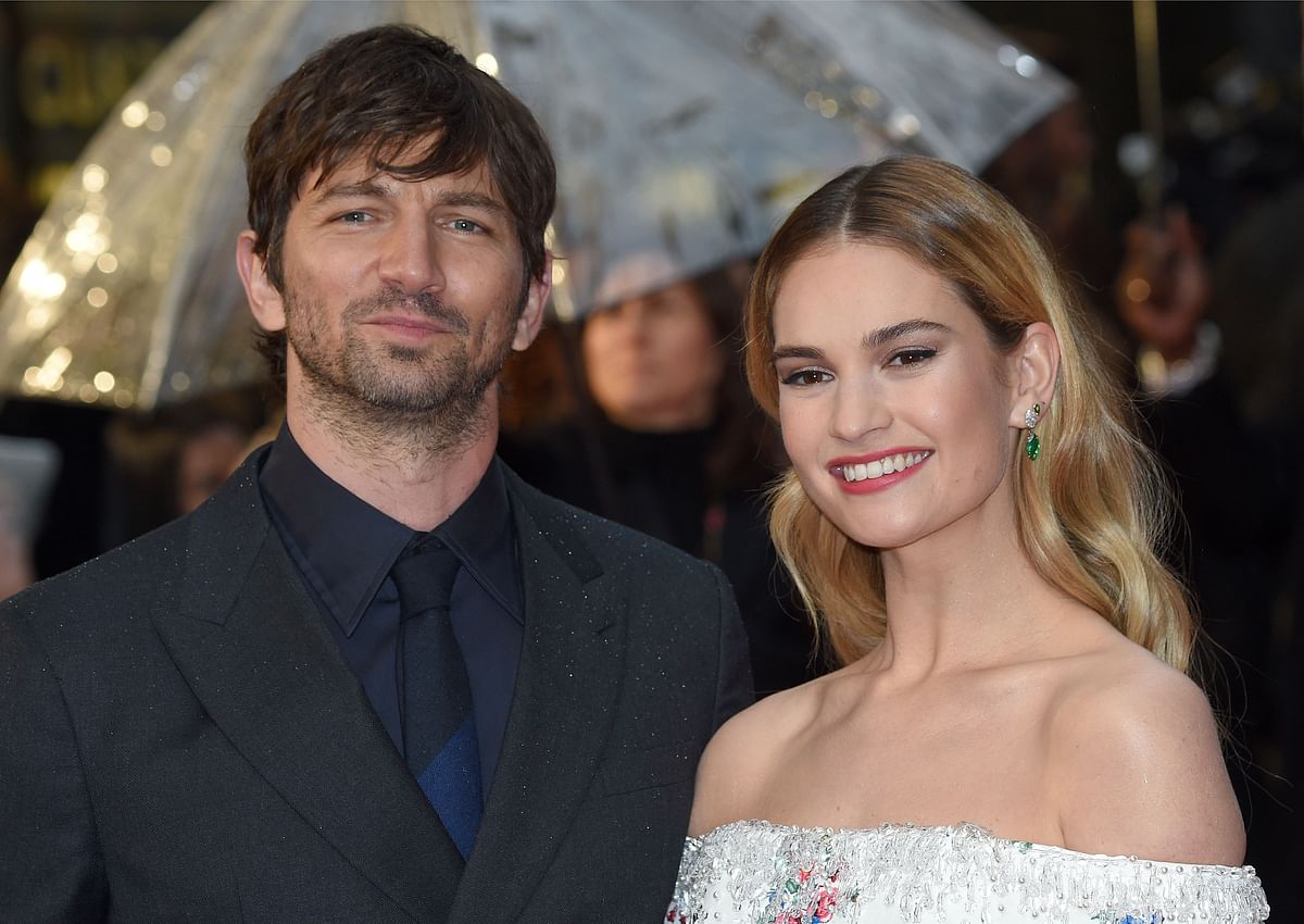 Dutch actor Michiel Huisman (L) and English actor Lily James pose on the red carpet upon arrival to attend the World premiere of the film `The Guernsey Literary and Potato Peel Pie Society` in London on 9 April. Photo: AFP