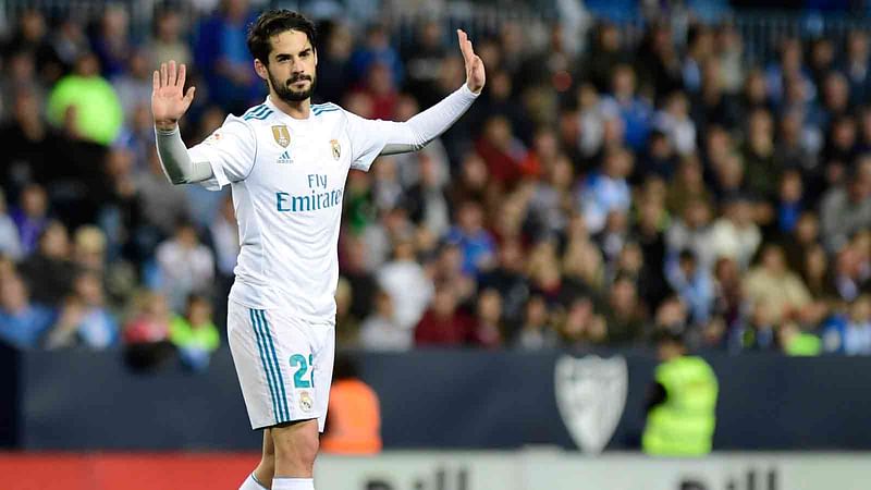 Real Madrid’s Spanish midfielder Isco celebrates a goal during the Spanish league footbal match between Malaga CF and Real Madrid CF at La Rosaleda stadium in Malaga on Sunday. Photo: AFP