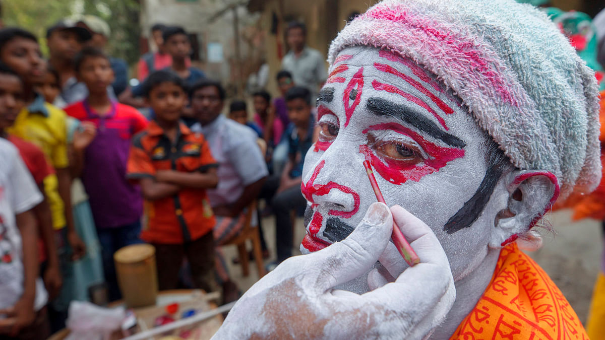A man paints his face like Lord Shiva during the Hindu festival Charak Puja in Kokdondi of Bashkhali, Chattogram on 14 April. Photo: Sourav Das