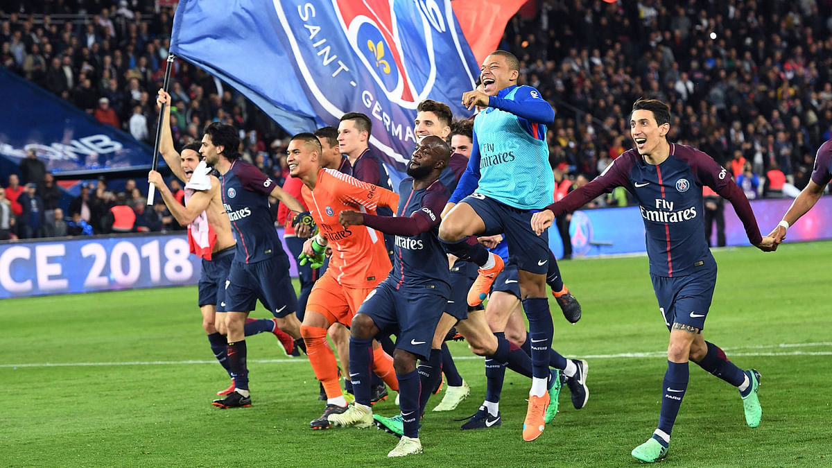Paris Saint-Germain`s Uruguayan forward Edinson Cavani celebrates after scoring a goal during the French L1 football match between Paris Saint-Germain (PSG) and Monaco (ASM) on April 15, 2018, at the Parc des Princes stadium in Paris. Paris Saint-Germain won the match and claim their seventh French League title. AFP