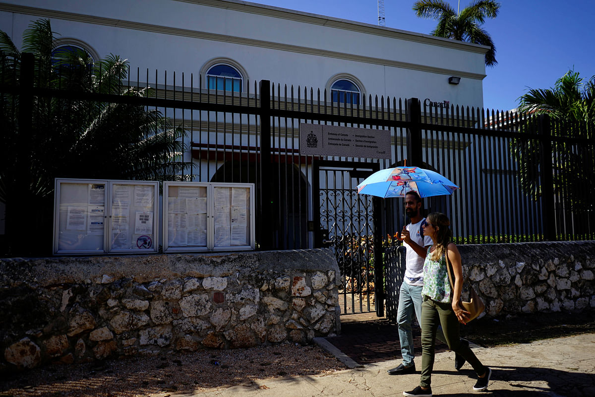 People pass by the Canada`s Embassy in Havana, Cuba, 16 April 2018. Reuters