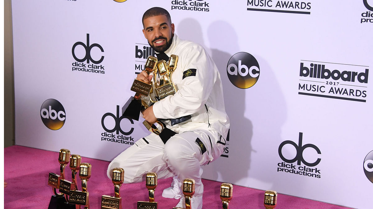 In this file photo taken on 21 May, 2017 rapper Drake poses in the press room with his awards during the 2017 Billboard Music Awards at the T-Mobile Arena in Las Vegas, Nevada. Photo: AFP
