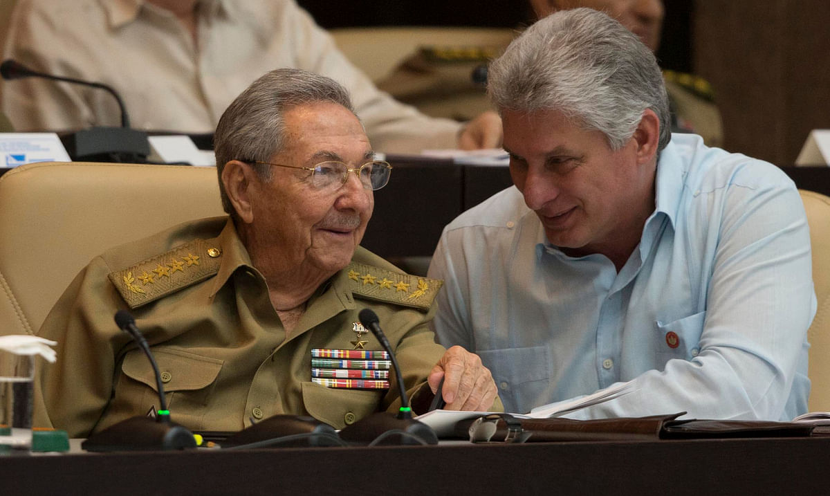 Cuban President Raul Castro (L) talks with First Vice-Presidente Miguel Diaz-Canel during the First Annual Session of the Cuban Parliament at the Convention Palace in Havana. AFP file photo