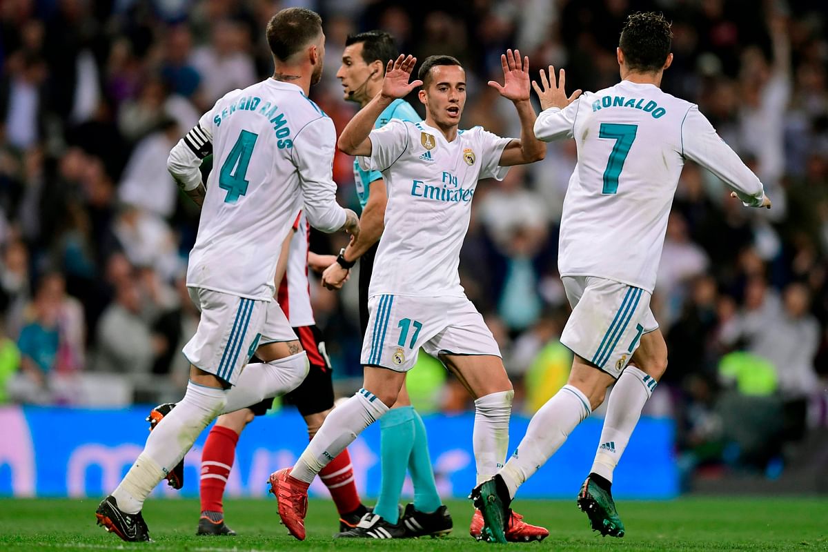Real Madrid’s Portuguese forward Cristiano Ronaldo ® celebrates with Real Madrid’s Spanish midfielder Lucas Vazquez after scoring during the Spanish league football match Real Madrid CF against Athletic Club Bilbao at the Santiago Bernabeu stadium in Madrid on Wednesday. Photo: AFP