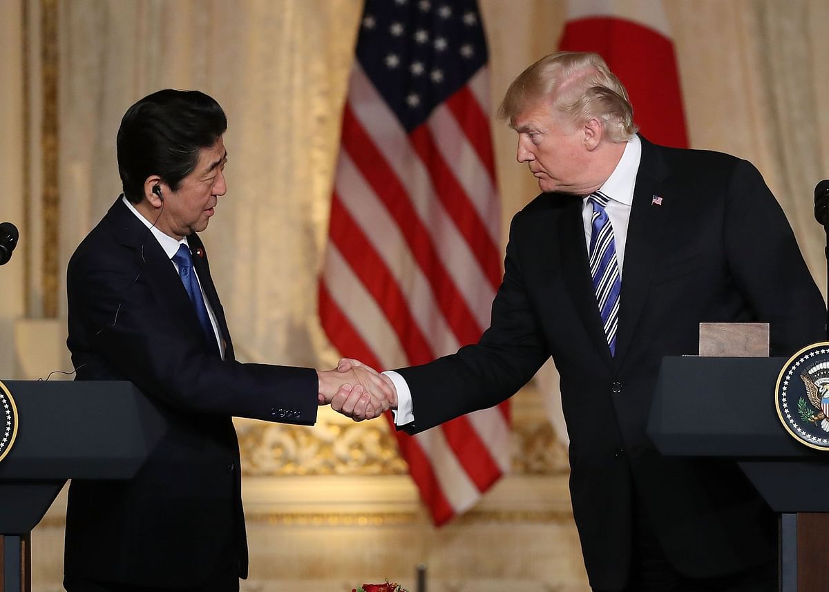 US President Donald Trump and Japanese Prime Minister Shinzo Abe shake hands at a news conference at Mar-a-Lago resort on 18 April 2018 in West Palm Beach, Florida. Photo: AFP