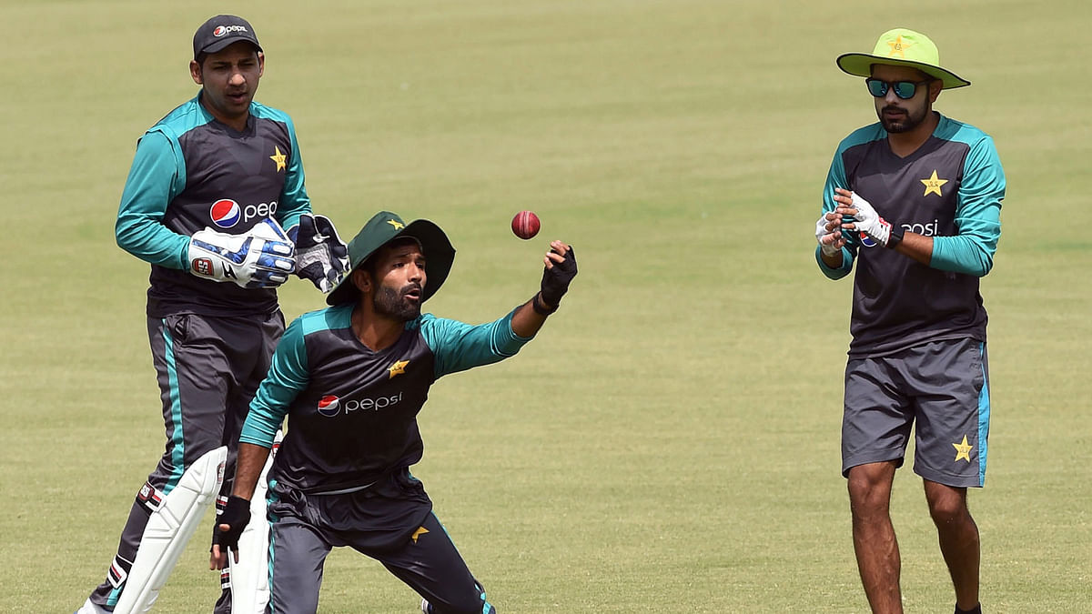 Pakistani cricket captain Sarfraz Ahmed (L) and teammates Asad Shafiq © and Babar Azam take part in a practice session during a training camp for the upcoming tours of Ireland and England, at the Gaddafi Cricket Stadium in Lahore on Thursday. Photo: AFP