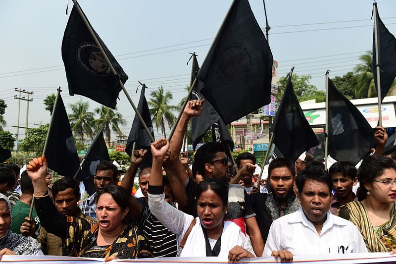 Bangladeshi activists chant slogans as they mark the fifth anniversary of the Rana Plaza building collapse at the site where the building once stood in Savar, on the outskirts of Dhaka, on 24 April 2018. AFP
