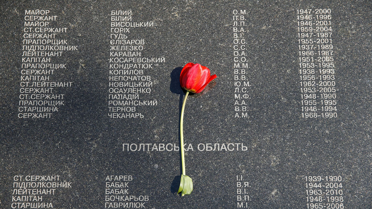 A flower is placed at the memorial during a commemoration ceremony to honour victims of the accident at the Chernobyl nuclear power plant in 1986 in Kiev, Ukraine on 26  April 26. Photo: Reuters