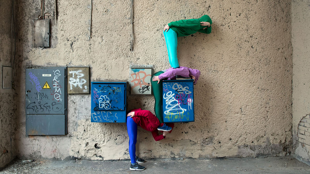 Performers present the Bodies in Urban Spaces project from Austrian artist Willi Dorner, in Vilnius, Lithuania on 28 April. Photo: AP
