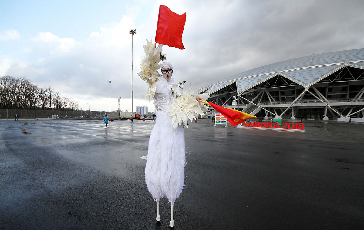 An artist performs waiting for football fans at the new the World Cup stadium in Samara prior to the Russian league soccer match in Russia on 28 April. Photo: AP