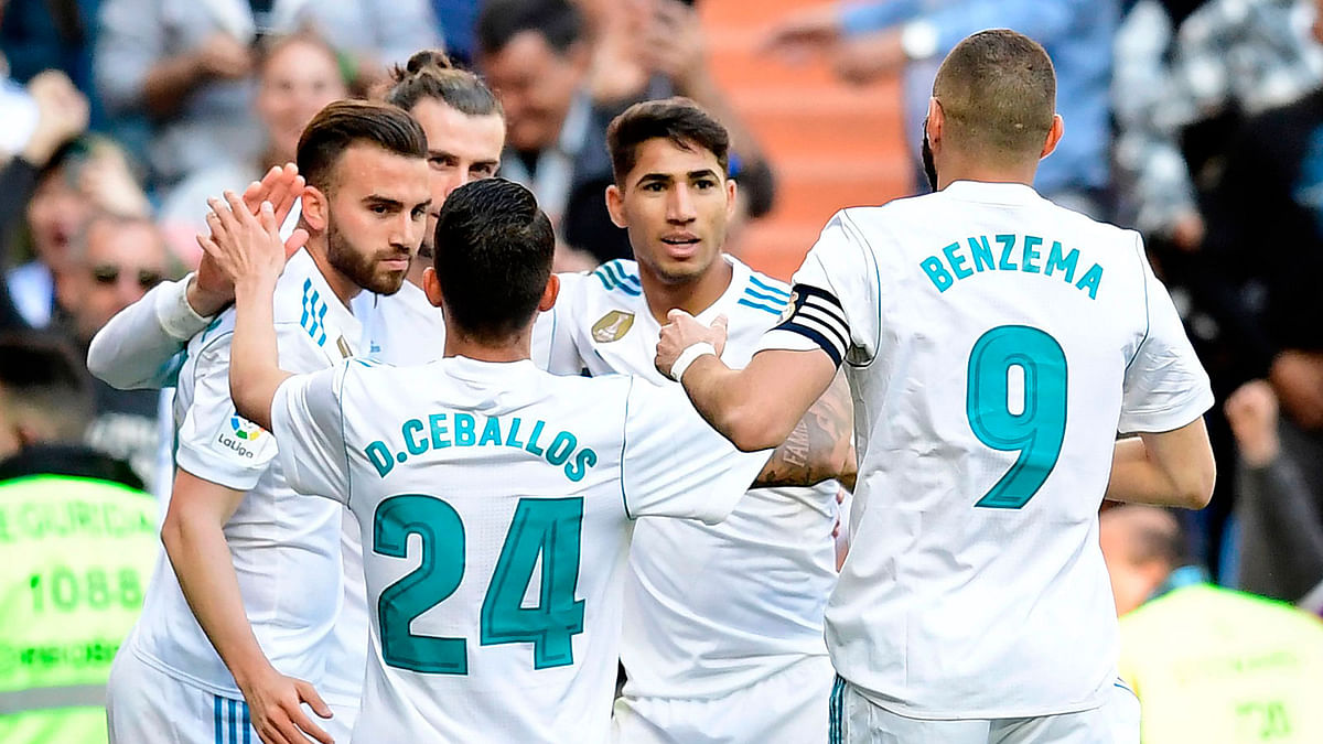 Real Madrid’s Welsh forward Gareth Bale (back 2ndL) celebrates with teammates after scoring a goal during the Spanish League football match between Real Madrid and Leganes at the Santiago Bernabeu Stadium in Madrid on Saturday. Photo: AFP
