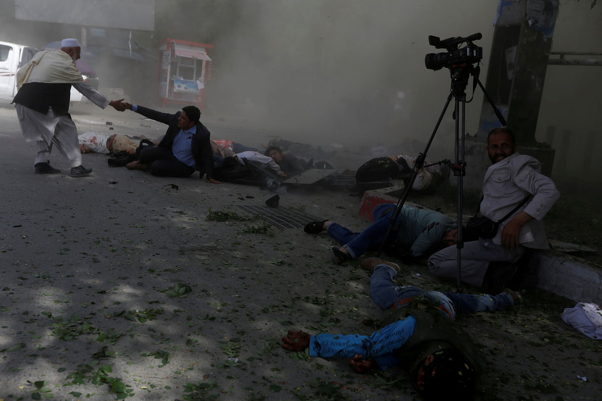 Afghan journalists are seen after a second blast in Kabul, Afghanistan 30 April, 2018. Photo: Reuters