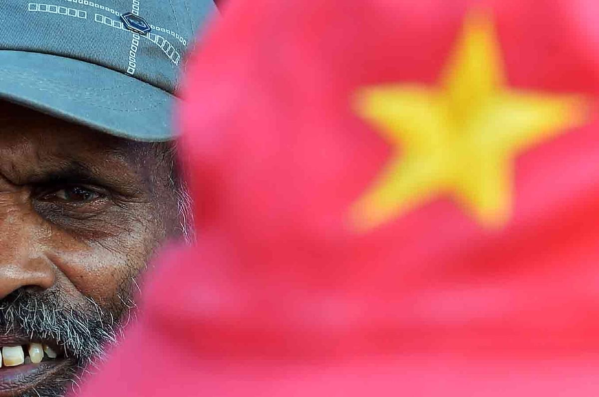 A supporter of the Frontline Socialist Party looks on as he takes part on a May Day rally in Colombo on 1 May, 2018. Photo: AFP