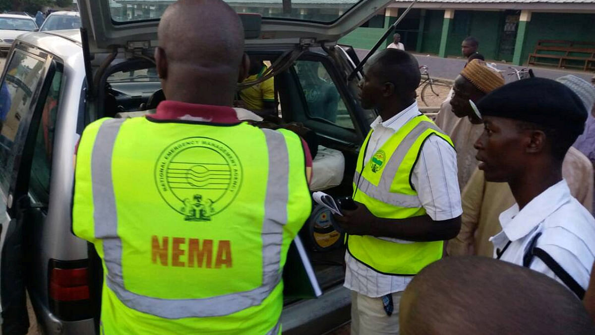 Members of the National Emergency Management Agency (NEMA) evacuate casualties from the site of blasts attack in Mubi, in northeast Nigeria on 1 May 2018. Reuters