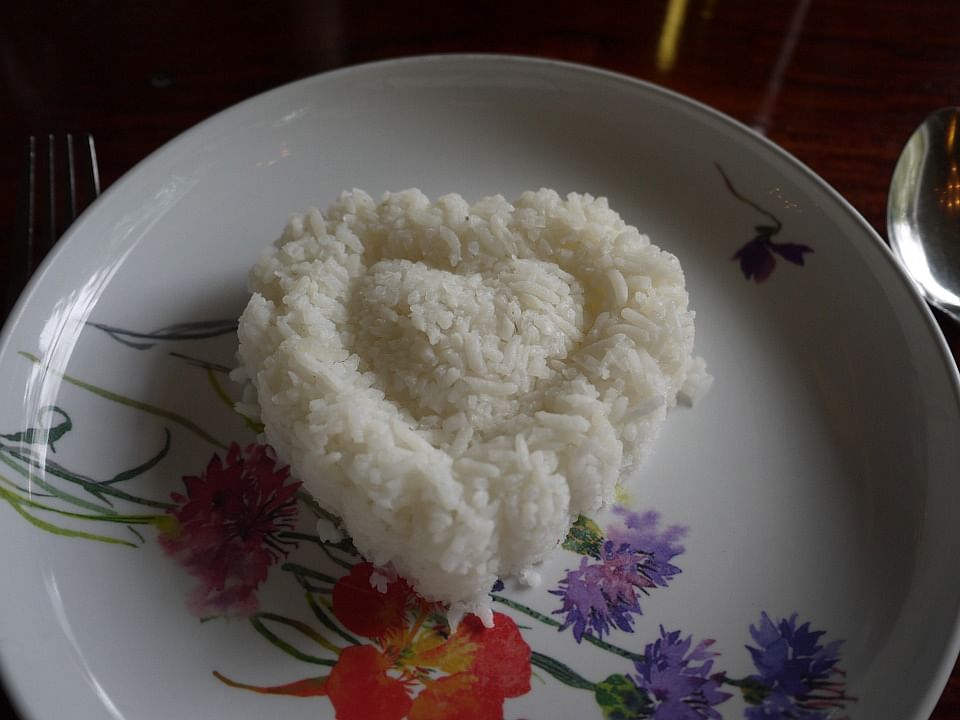 Eating lots of refined white rice may advance the start of menopause by about one-and-a-half years, warns study. Photo: Collected  Menopause and eating rice
