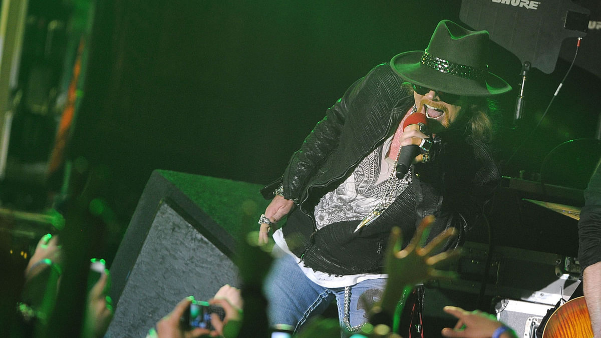 In this file photo taken on 9 March, 2012 singer Axl Rose of Guns N` Roses performs at the Hollywood Palladium in Hollywood, California. Photo: AFP